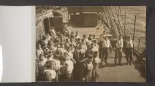 [Soldiers in life vests on the deck of a ship practising evacuation drills]