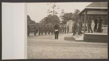 [King George VI, Queen Elizabeth and assorted British Army generals leaving a reviewing platform.]