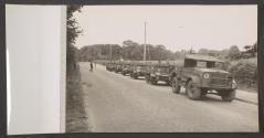 [Bren Gun Carriers and a truck from the 59th (Staffordshire) Infantry Division lined up for review parade]