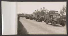 [Bren Gun Carriers and a truck from the 59th (Staffordshire) Infantry Division lined up for review parade]