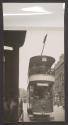 [Double decker streetcar on a Belfast street]
