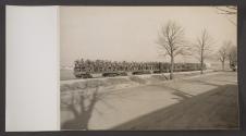[Soldiers riding in open rail cars]