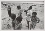 In a Jogi dera somewhere in Bikaner. The boy being slapped is mentally handicapped.