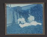 [Two women with cats]