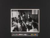 A Vietnamese Navy petty officer presents a "psyops" package to Seafloat visitors