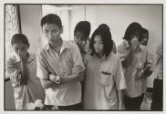 High-School pupils look over a macabre exhibit at the HIV Museum at Wat Prabat Nampu, Chaing Mai