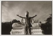 Choo Chart Sinna, an HIV+ monk at Wat Prabat Nampu, throws open his arms, says "O Lord Buddha save me"