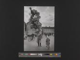 [Street vendor selling balloons]