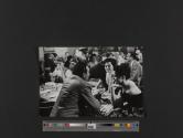 [Anthony Quinn and Sophia Loren sitting at table during the filming of The Black Orchid, Hollywood']