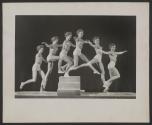 [Multiple exposure of a teenage girl wearing underwear jumping onto, and off of, wooden stairs]