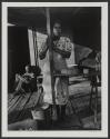 Woman on a porch, West Palm Beach, Florida