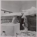 [Baronesa standing near newly-installed aqueduct]