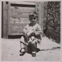 [Giuseppe Toscano, child of the photographer, holding a cat]