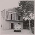 [Car parked in front of building]