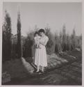 [Woman holding baby]