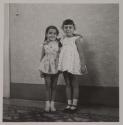 [Rosa Maria Toscano (left), child of the photographer, with a friend]