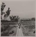[Man standing in aqueduct]