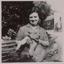 [Anna Toscano, wife of the photographer, with a lion at a zoo in Rome]