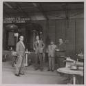 [Tommaso Toscano (second from right) and three other men at a machinery showroom]