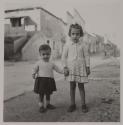 [Two children]