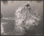 [Nude woman being splashed by water]
