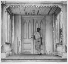 Man on a church porch, West Palm Beach, Florida