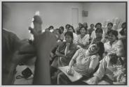 A woman bursts into laughter during an AIDS education class which is mandatory for Philippinas who are heading to foreign countries as domestic helpers in Asia and the Middle East