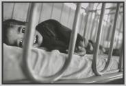 Gasping for air, an orphaned boy fights the final stages of AIDS