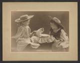 [Two children with cat]