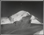 [Aerial view of the moon over the Swiss Alps]