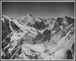 [Aerial view of the Swiss Alps]