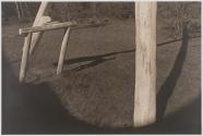 [Wooden posts and shadows]
