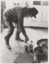 [Edward Steichen tending plants in his greenhouse]