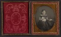 [Child with doll, holding mother's hand]