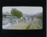 [Washing vegetable in stream]