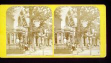 [Group of people sitting in front of house]