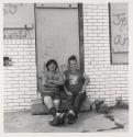 [Couple on step, Buffalo, New York]