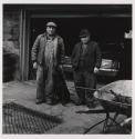 [Two men in front of garage, Buffalo, New York]