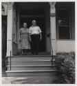 [Husband and wife on porch of #167, Buffalo, New York]