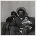 [Father with son and cigarette, Buffalo, New York]