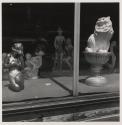 [Shop window with ceramic cat and semi-nude, Buffalo, New York]