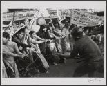 Saigon, Vietnam 1963 - Buddhist monks and women yank at a barbed wire barricade in front of the Giac Minh Pagoda during a demonstration against South Vietnamese President Ngo Dinh Diem, a Roman Catholic.