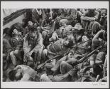 Saigon, Vietnam 1963 - Weary South Vietnamese troops sprawl in a Navy troop carrier chasing Vietcong guerillas in the swamplands of South Vietnam.