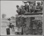 Vietnam 1964 - Near the Cambodian border, a father holds the body of his child as South Vietnamese Rangers look down from their armoured vehicle