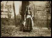 [Elisabeth Freeman dressed as a gypsy, holding a tambourine]