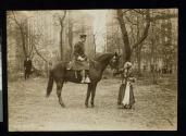 [Mounted policeman, Elisabeth Freeman petting horse]