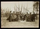 [Group of eleven women and three men with a banner that reads "Votes for women pilgrimage from New York City to Washington, DC 1913"]