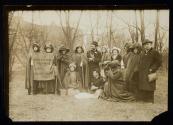 [Group of eleven women and three men with a banner that reads "Votes for women pilgrimage from New York City to Washington, DC 1913"]