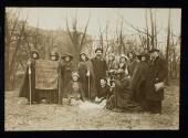 [Group of eleven women and three men with a banner that reads "Votes for women pilgrimage from New York City to Washington, DC 1913"]
