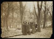 [Group of five women standing with cloaks, walking sticks and a banner that reads "Votes For Women Pilgrimage from New York City to Washington, DC 1913"]
